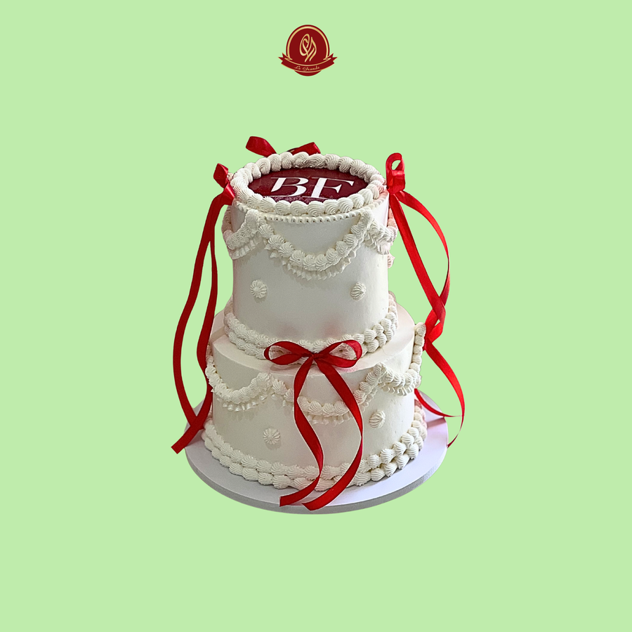 Two-tier classic Birthday Cake with White Piping and Crimson Red Silk Ribbons | Abu Dhabi & UAE Delivery in Abu Dhabi | Birthday Cakes – Adults Delivery UAE – Legrandeuae