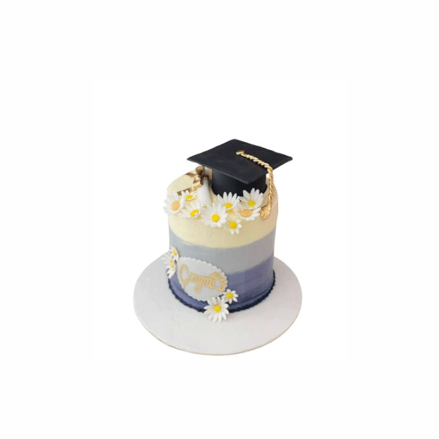 Colorful Graduation Cake with Flowers & Cap – Elegant Celebration Cake | Abu Dhabi & UAE Delivery in Abu Dhabi | Graduations Cakes Delivery UAE – Legrandeuae