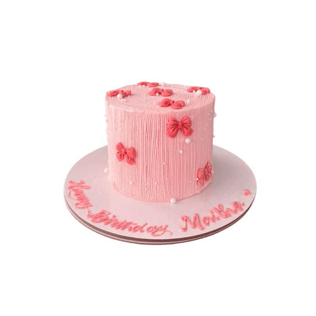 Pink Bow & Floral Buttercream Stem Shape Birthday Cake, Vertical Textured Piping with Handcrafted Look - Abu Dhabi