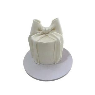Elegant white fondant cake decorated with a large bow - Abu Dhabi in Abu Dhabi | Birthday cakes - Children Delivery UAE – Legrandeuae