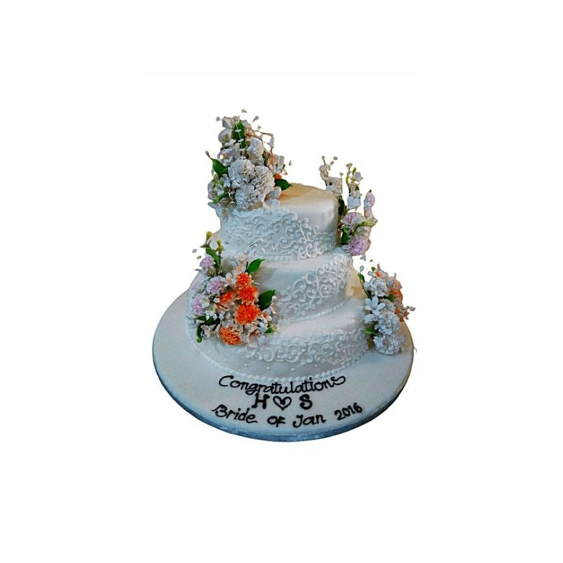 Three-Tier Wedding Cake with White Lace Icing & Floral Accents – Elegant Engagement Cake | Abu Dhabi & UAE Delivery in Abu Dhabi | Wedding / Engagement Cakes Delivery UAE – Legrandeuae