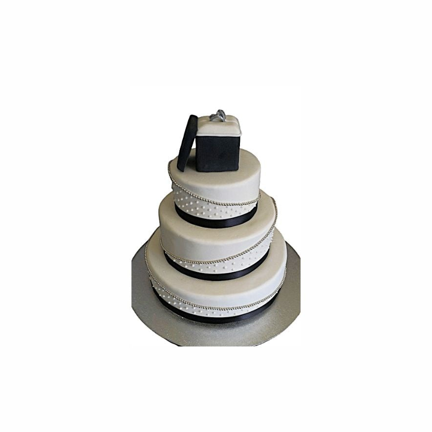 Three-Layer White Wedding Cake with Black Ribbon & Ring Box – Elegant Engagement Cake | Abu Dhabi & UAE Delivery in Abu Dhabi | Wedding / Engagement Cakes Delivery UAE – Legrandeuae
