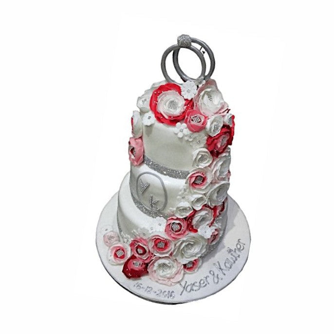 Three-Tier White Wedding Cake with Floral Décor & Rings – Luxury Wedding Cake | Abu Dhabi & UAE Delivery in Abu Dhabi | Wedding / Engagement Cakes Delivery UAE – Legrandeuae