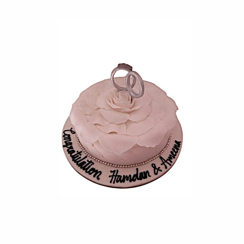 White O’Hara Rose Wedding Cake with Platinum Ring Topper – Luxury Engagement Cake | Abu Dhabi & UAE Delivery in Abu Dhabi | Wedding / Engagement Cakes Delivery UAE – Legrandeuae