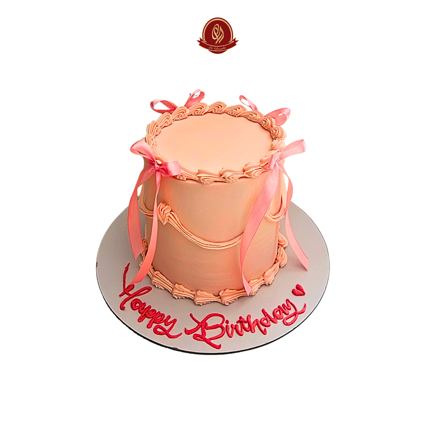 pink cake with Bow Abu Dhabi