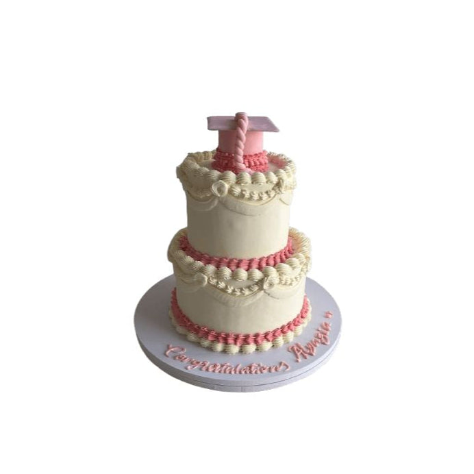 Two-Tier Pink & White Vintage Graduation Cake with Cap Topper – Abu Dhabi in Abu Dhabi | Graduations Cakes Delivery UAE – Legrandeuae