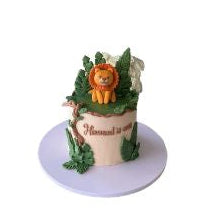 Lion-Themed Jungle Birthday Cake with Cute Fondant Lion Topper and Tropical Green Leaves - Abu Dhabi in Abu Dhabi | Birthday cakes - Children Delivery UAE – Legrandeuae