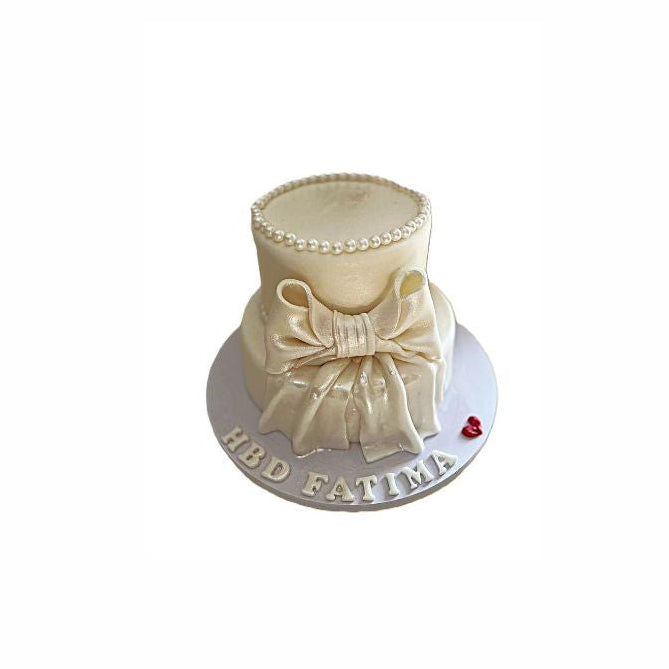 Two-tier Birthday Cake with Large Bow and Pearl Detailing Around the Top Edge - Abu Dhabi in Abu Dhabi | Birthday Cakes – Adults Delivery UAE – Legrandeuae
