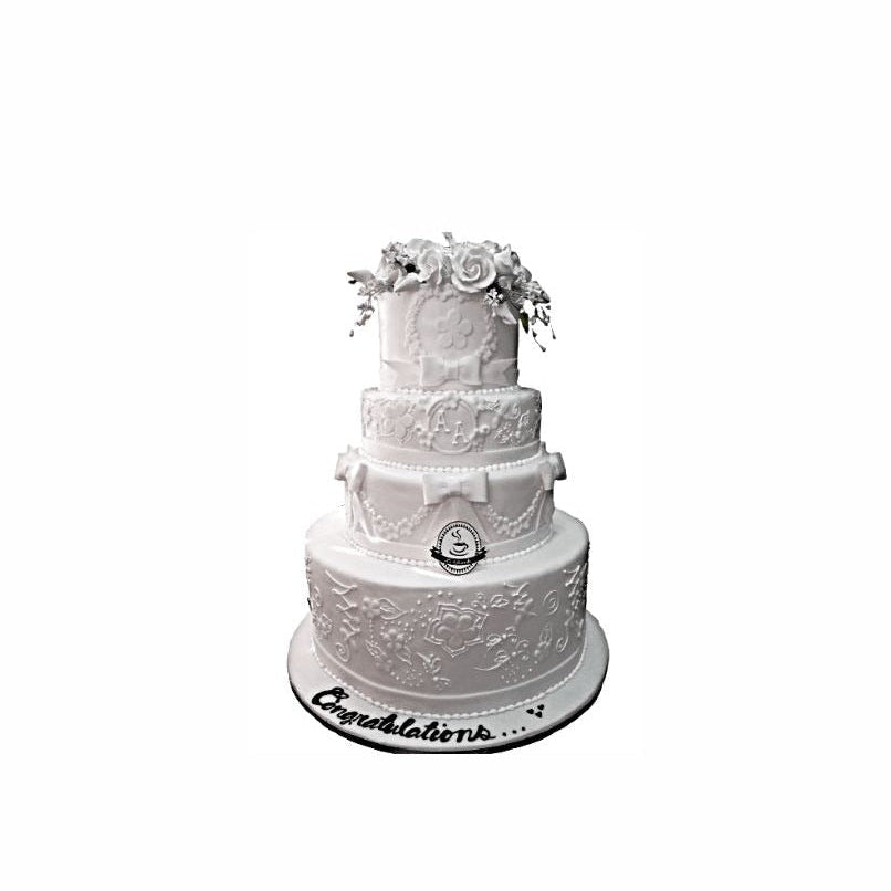 Four-Layer White Wedding Cake with Intricate Patterns & Floral Topper – Elegant Engagement Cake | Abu Dhabi & UAE Delivery in Abu Dhabi | Wedding / Engagement Cakes Delivery UAE – Legrandeuae