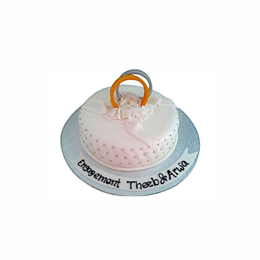 Simple Classic White Engagement Cake with Golden Rings – Elegant Wedding Cake | Abu Dhabi & UAE Delivery in Abu Dhabi | Wedding / Engagement Cakes Delivery UAE – Legrandeuae