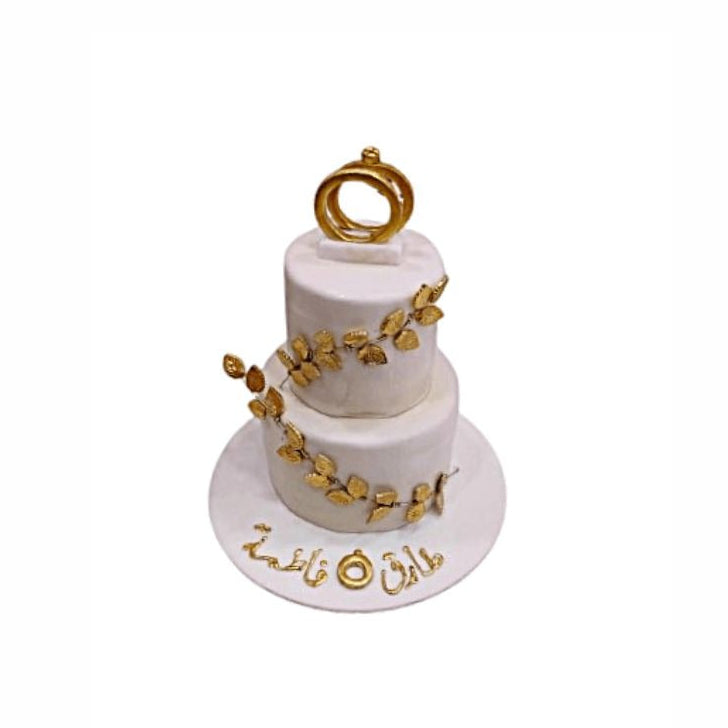 Two-Tier Classy Engagement Cake with Leaf Garlands & Ring Topper – Elegant Wedding Cake | Abu Dhabi & UAE Delivery in Abu Dhabi | Wedding / Engagement Cakes Delivery UAE – Legrandeuae