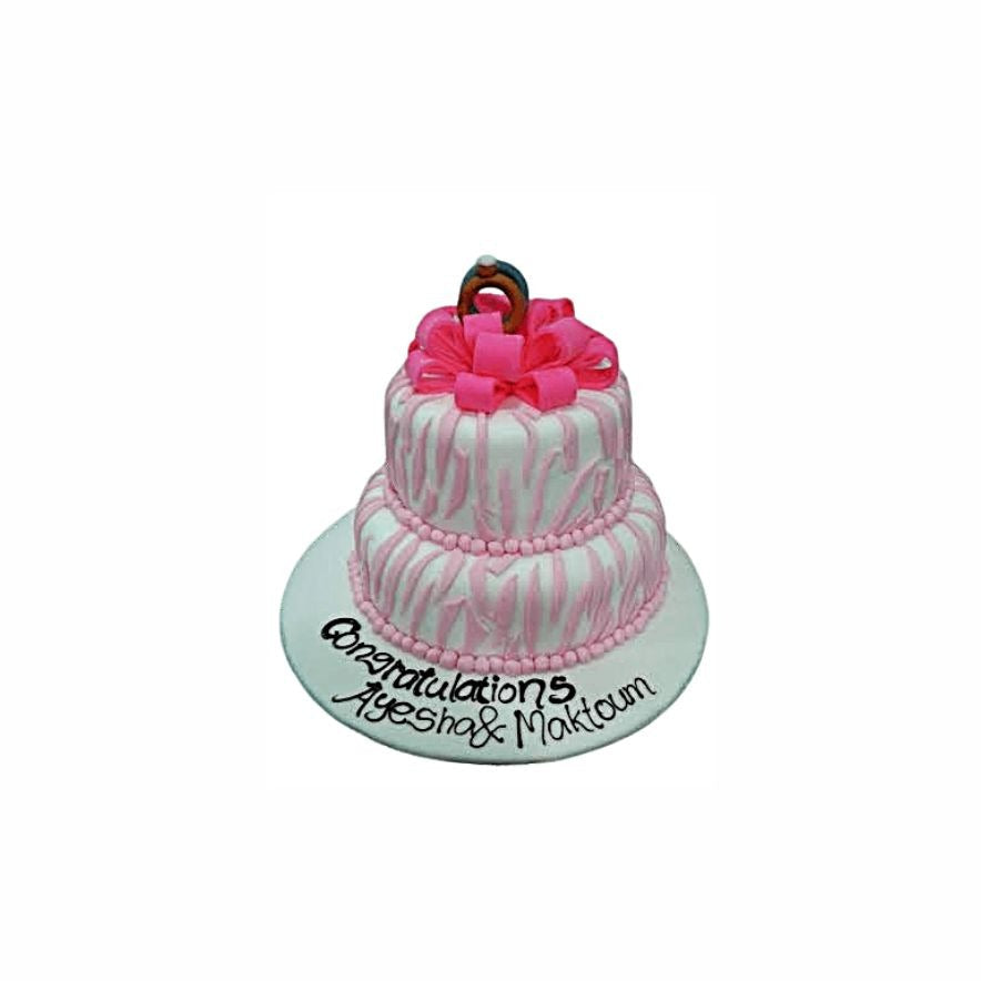 Pink & White Striped Wedding Cake with Ribbon & Ring Topper – Elegant Engagement Cake | Abu Dhabi & UAE Delivery in Abu Dhabi | Wedding / Engagement Cakes Delivery UAE – Legrandeuae